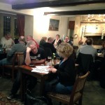 Pub Quiz - teams working on answers